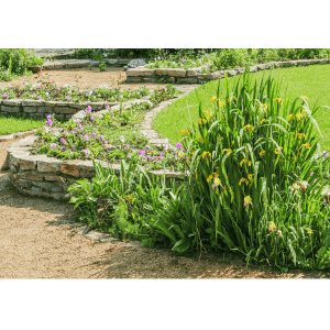 landscaping rocks woodstock ga - What are the Different Types of Landscaping Rocks and Their Uses - a series or short retaining walls used as garden beds with flowers and plants